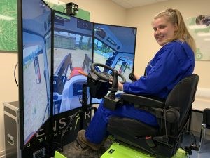 First year Agriculture student Charlotte Houston on the tractor driving simulator at Greenmount campus
